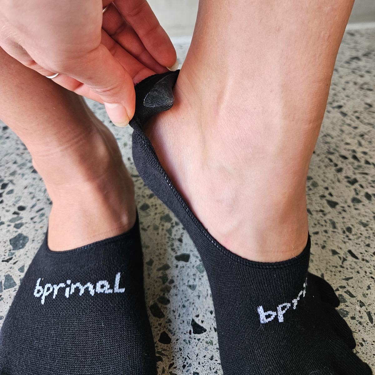 Close up of the grip inside a pair Black Bprimal Everyday Five-Toe Socks - Hidden