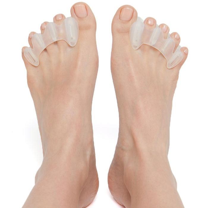 Close up of bare feet wearing bprimal Correct Toes® - Toe Spacers