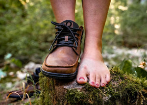 Strong Feet barefoot boot standing on rock
