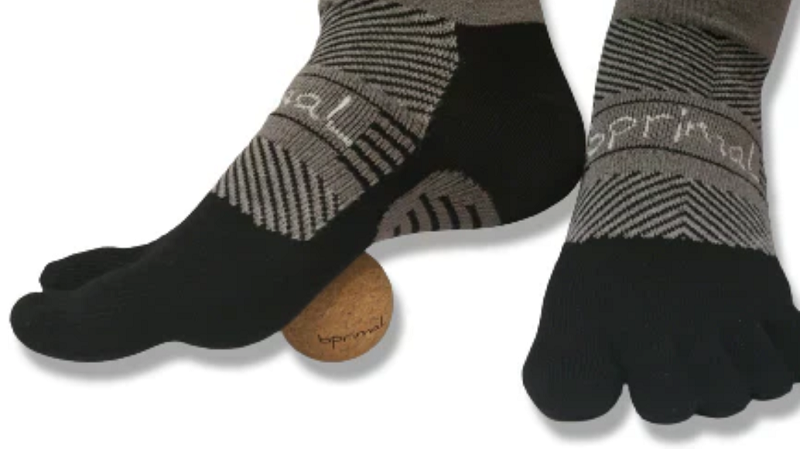 photo of a person wearing a bprimal toe socks and cork ball