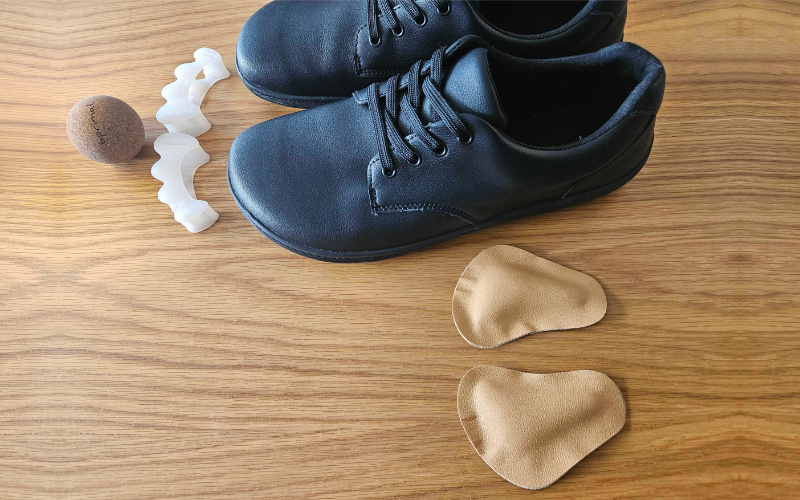 Bprimal Oxford Vegan Black barefoot shoes with metatarsal pads, toe spacers, and cork massage ball, designed to support foot strength, toe alignment, and natural movement.