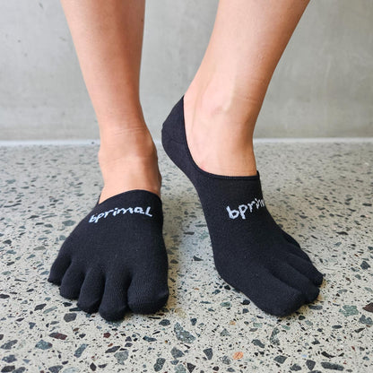 Front view of person wearing Black Bprimal Everyday Five-Toe Socks - Hidden with one heel raised